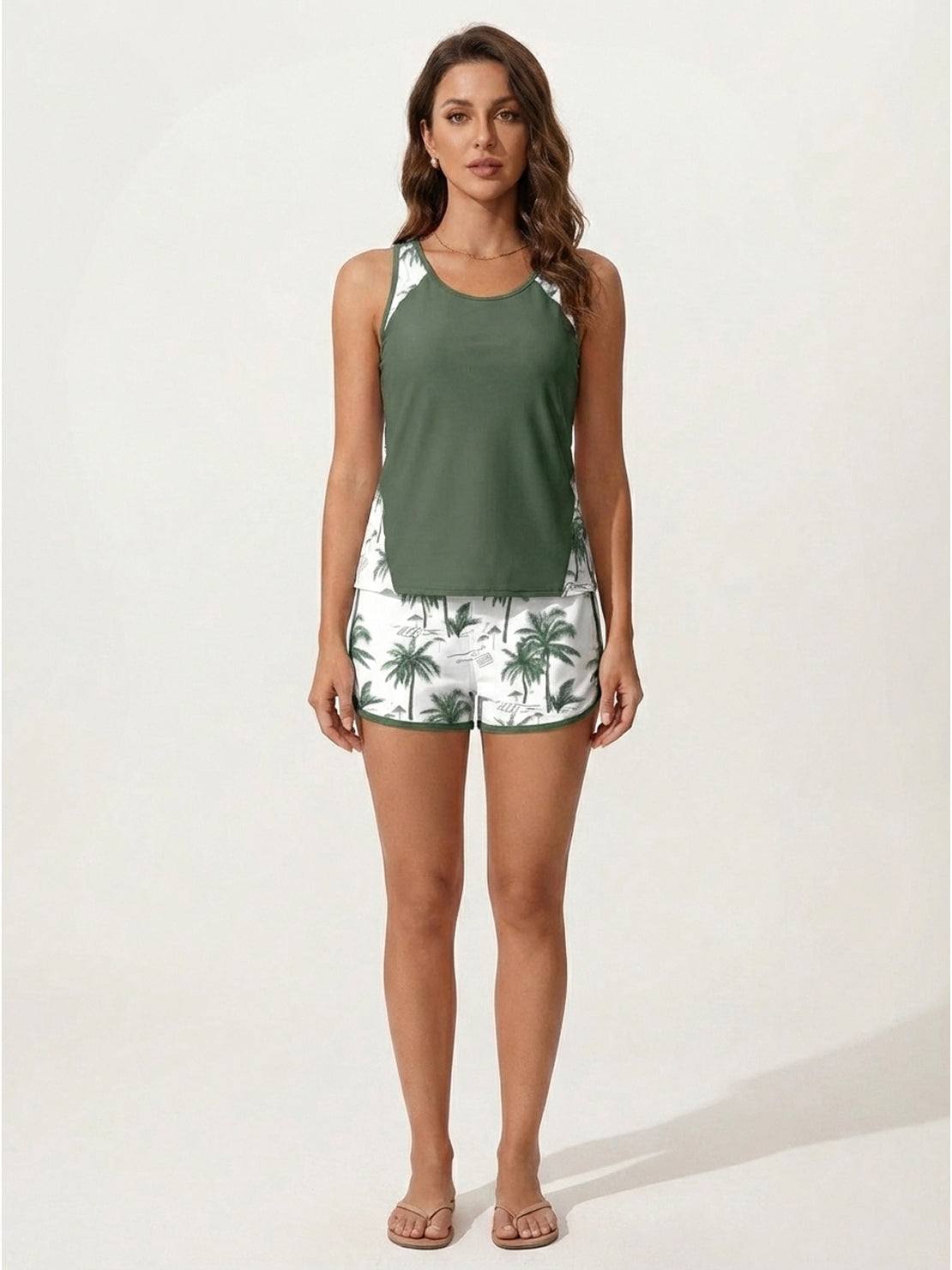 Racerback two-piece tankini set with scoop neckline and tropical print swim shorts featuring pockets and drawstring waistband