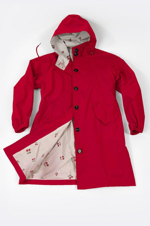 Red water-resistant oversized windbreaker rain jacket with hood and floral interior lining