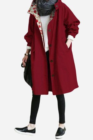 Water-Resistant Oversized Windbreaker rain jacket in burgundy with floral inner lining and front buttons.