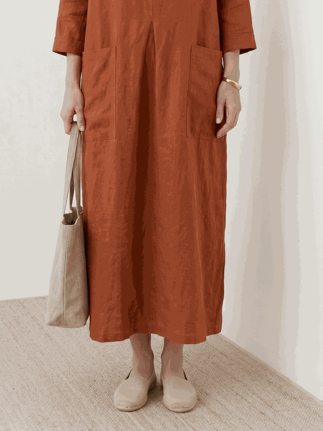 100% cotton pocket maxi dress with 3/4 sleeves and side slits in a relaxed A-line silhouette
