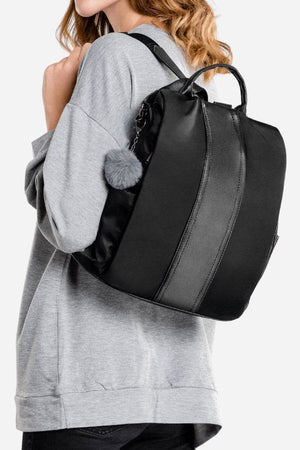 Black anti-theft waterproof fashion backpack with adjustable straps worn by person in gray sweatshirt