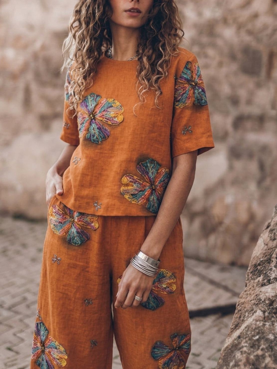 woman wearing soft tailored loose fit co-ord set with wide-leg bottoms in breathable cotton