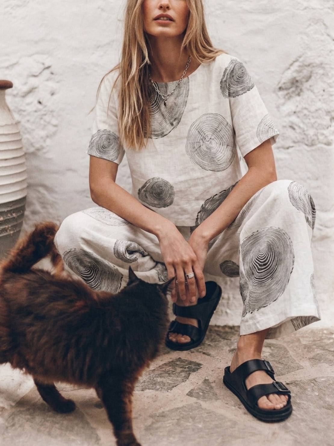 woman wearing a soft tailored loose fit co-ord set with wide-leg pants in light cotton fabric