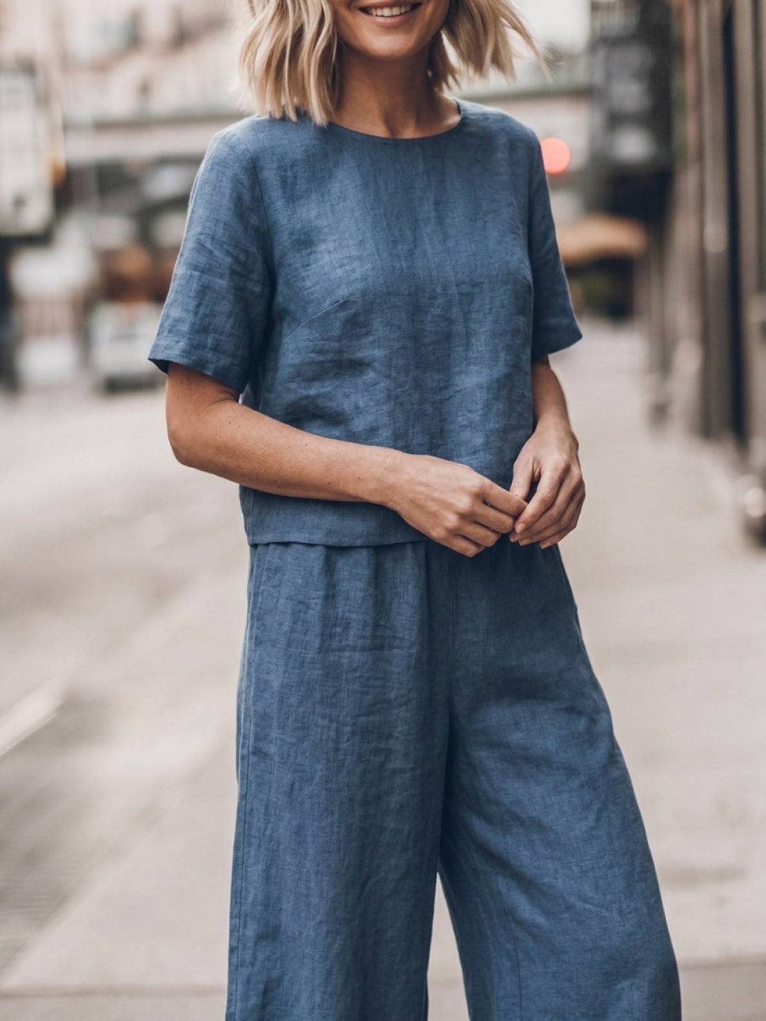 Woman wearing a soft cotton loose fit co-ord set with wide-leg pants and a relaxed, boxy short-sleeve top