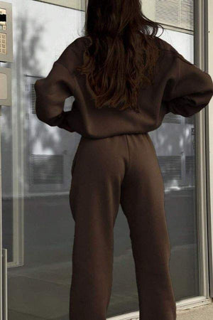 woman wearing brown Classic Airplane Set two-piece tracksuit from Halloween Collection viewed from back