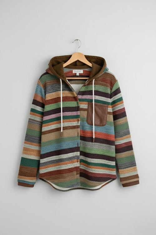 Highland Plaid Shacket with colorful striped pattern, attached hood, and front chest pocket hanging on wooden hanger