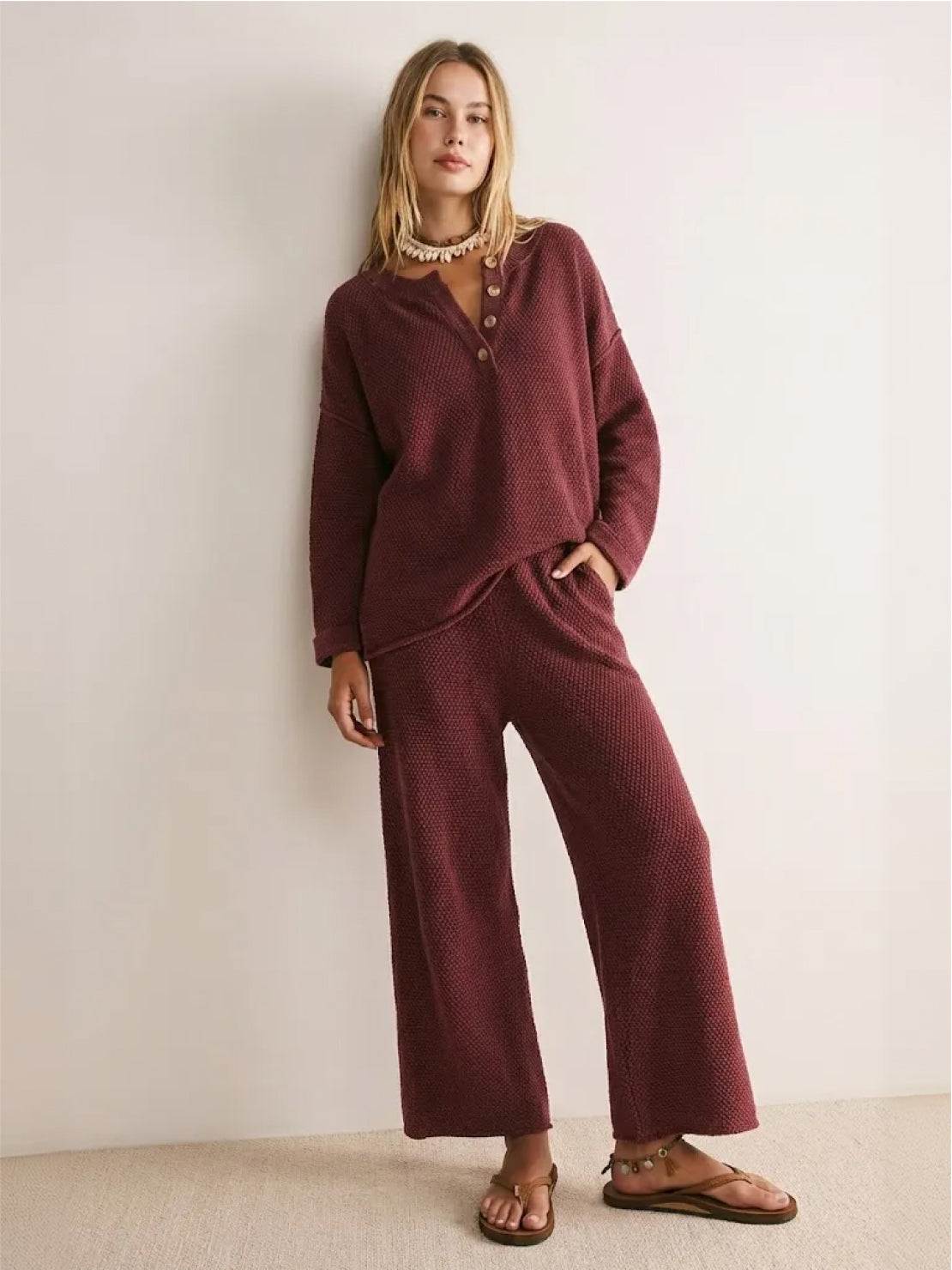 Woman wearing multi-weather comfort two-piece oversized set in casual outdoor setting