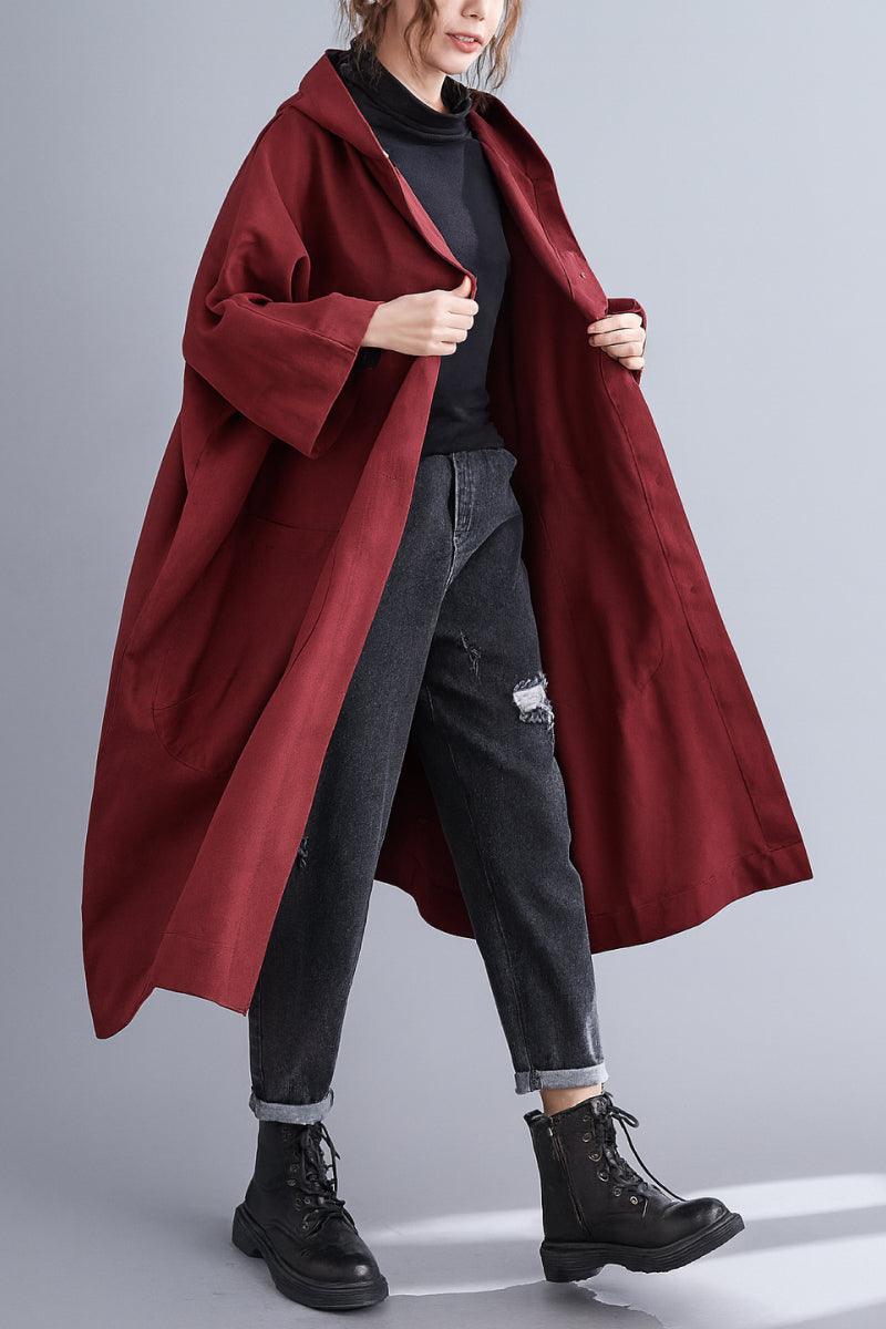 Oversized water resistant maroon windbreaker jacket with waterproof design and roomy fit for layering