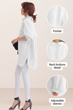 Woman wearing oversized linen shirt in white with back buttons, pocket, and adjustable sleeves detail