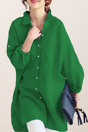 Green oversized linen shirt with button-down front and relaxed fit worn by woman