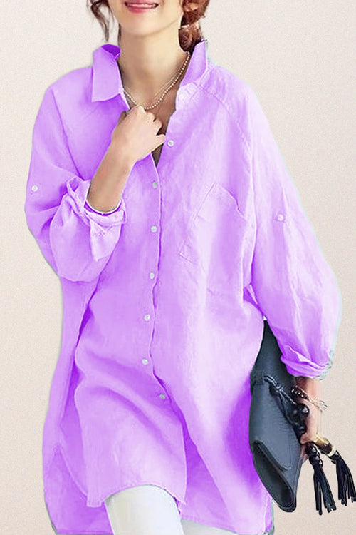 Oversized linen shirt in lavender with relaxed fit, button-down front, and rolled sleeves.