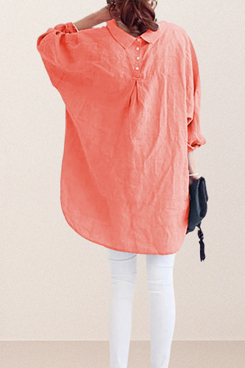 Back view of oversized linen shirt in sun-washed pink with loose sleeves and button detailing