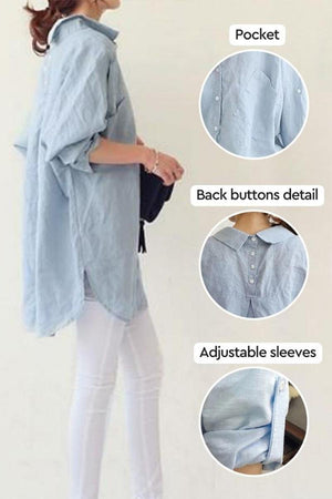 Woman wearing light blue oversized linen shirt with pocket, back buttons, and adjustable sleeves details