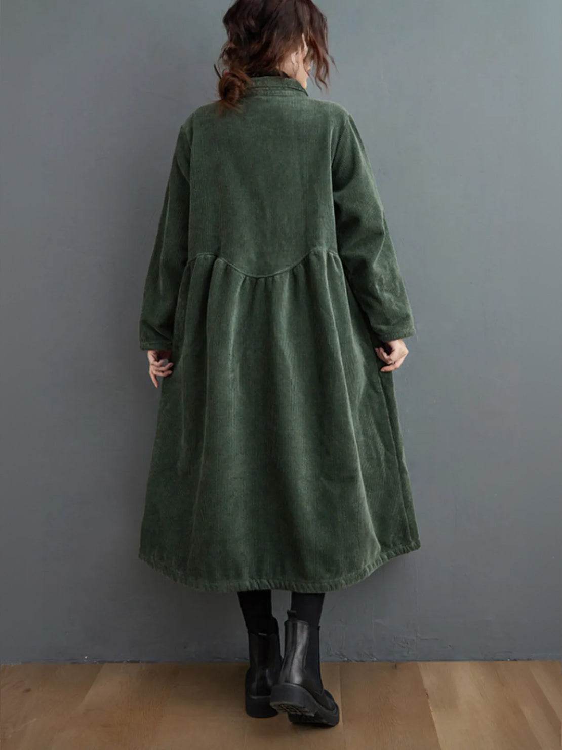 Oversized vintage corduroy coat in warm earth tones with thick textured fabric and deep pockets for cold weather comfort