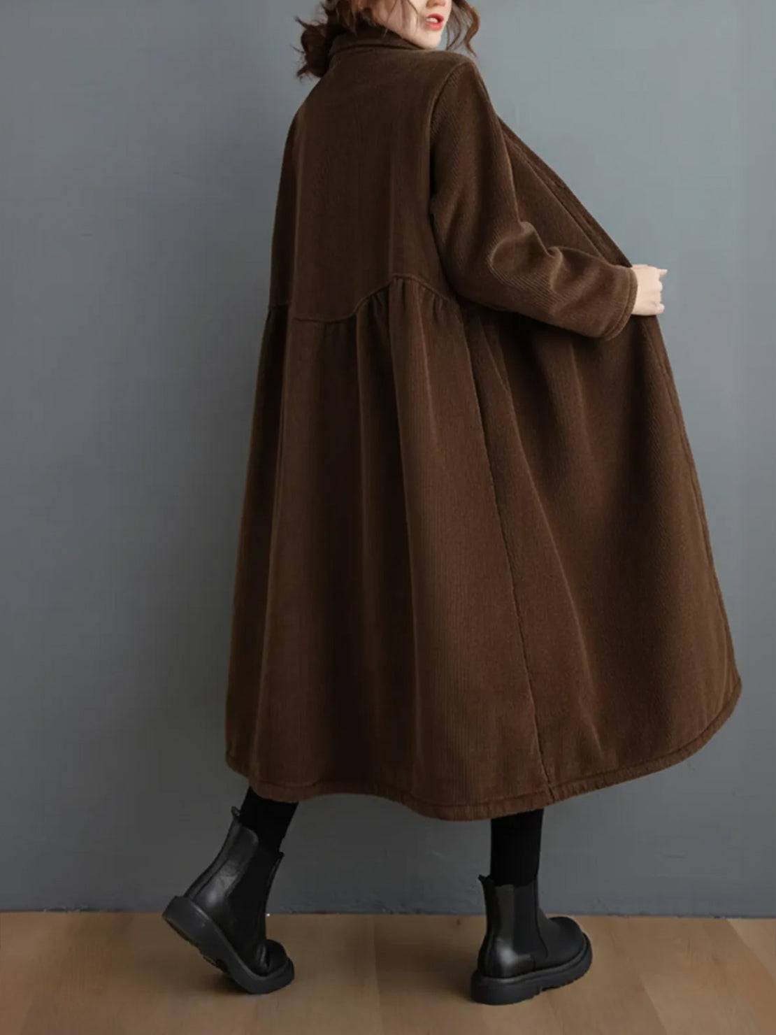 Oversized vintage corduroy coat in warm earth tones with thick texture and classic fit