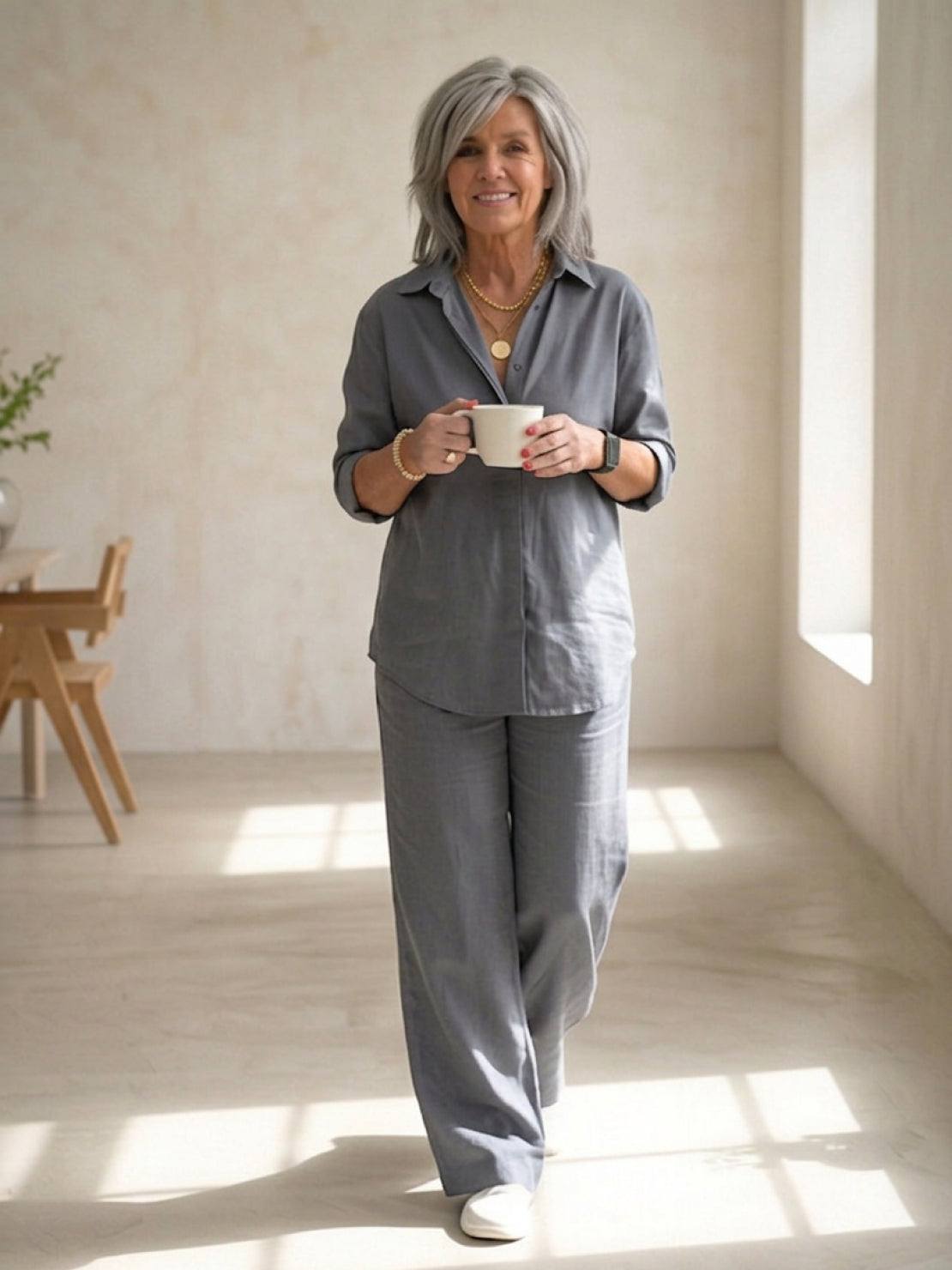 Woman wearing relaxed shirt and loose trousers two-piece set in monochrome style