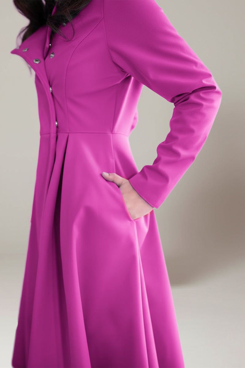 Water-repellent A-line hooded women's raincoat in vibrant pink with belt and flattering fit