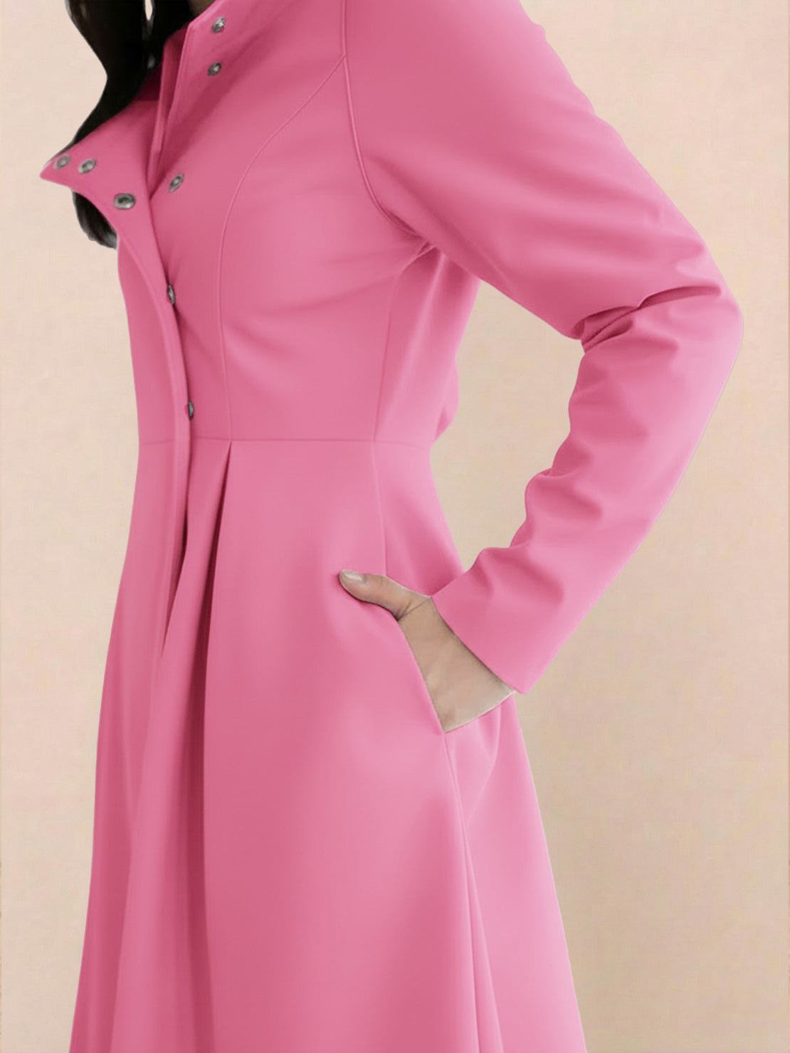 Woman wearing water-repellent A-line hooded raincoat outdoors