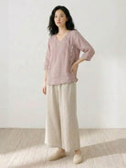 100% cotton linen blend golden hour set with embroidered V-neck top and high-waisted flowy trousers