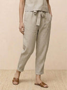 woman wearing relaxed cotton linen set with short sleeves and straight-leg pants in monochrome tones