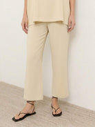 Cotton-blend capelet lounge set with mock neck top and wide-leg pants in smooth fabric