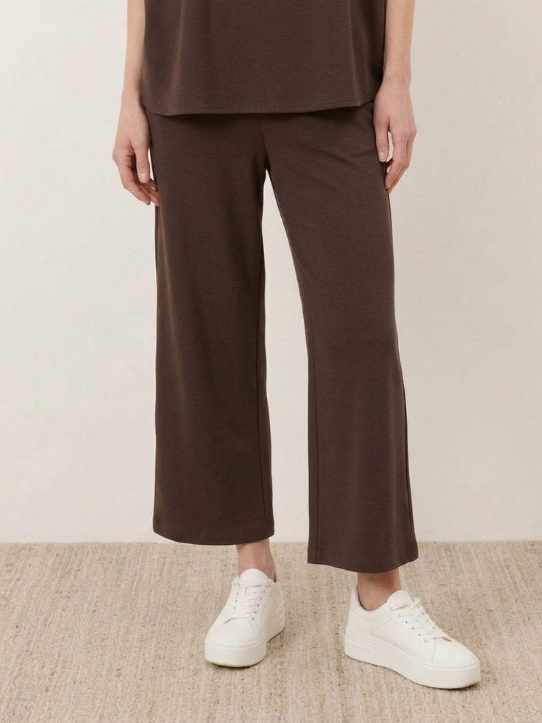 Woman wearing cotton-blend capelet lounge set with mock neck top and wide-leg pants in chocolate brown