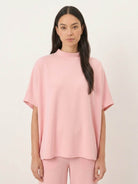 Woman wearing cotton-blend capelet lounge set with mock neck top and wide-leg pants in chocolate brown