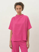 Cotton-blend capelet lounge set with mock neck top and wide-leg pants in neutral tones