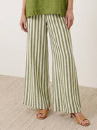 Woman wearing a striped wide-leg co-ord set with oversized top and palazzo pants