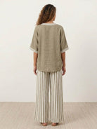 Black striped wide-leg co-ord set with oversized top and palazzo pants