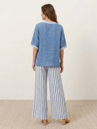 Black striped wide-leg co-ord set with oversized top and palazzo pants with elastic waist and side pockets