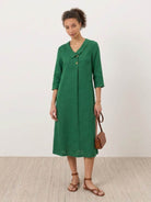 Navy linen-look midi dress with relaxed A-line silhouette and side pockets