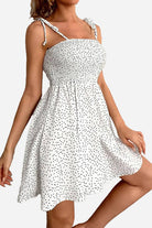 White bohemian skater dress with black polka dots and sling knot straps, summer mini dress.