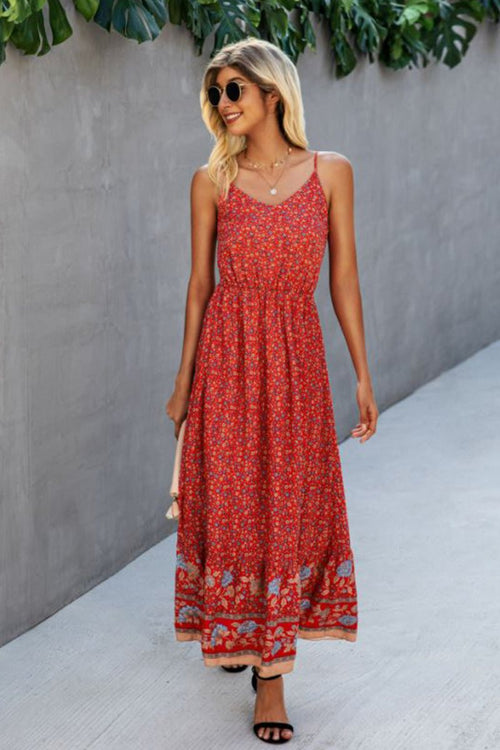Woman wearing a casual vintage flower prints maxi dress with spaghetti straps and elastic waist