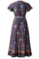 Back view of Bohemian floral print wrap dress with short sleeves and ruffle skirt on dark fabric