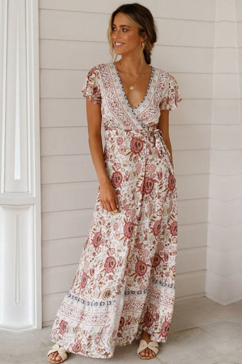 Woman wearing Bohemian floral print wrap dress with V-neck and short sleeves