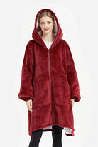 Oversized ultra soft hooded blanket in deep red with zipper and large front pockets, cozy and warm flannel sherpa material.