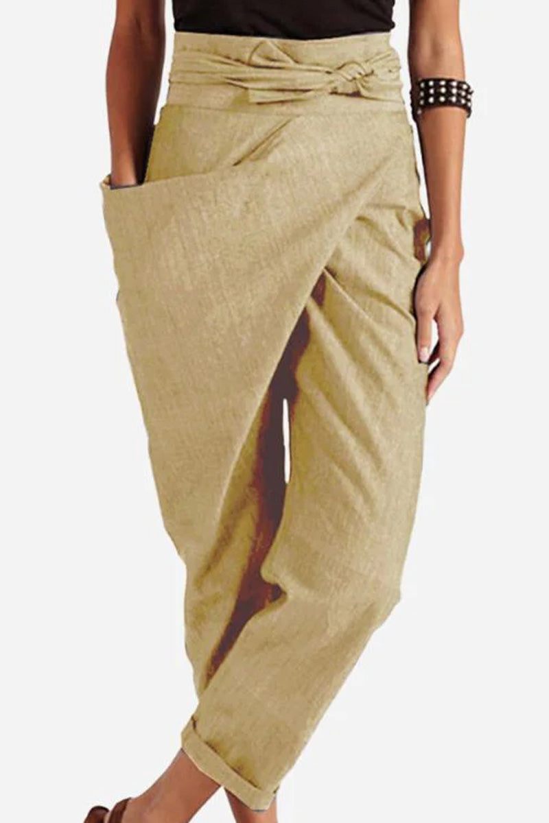 Women wearing beige high-waist wrapped pants with a side pocket and belt detail