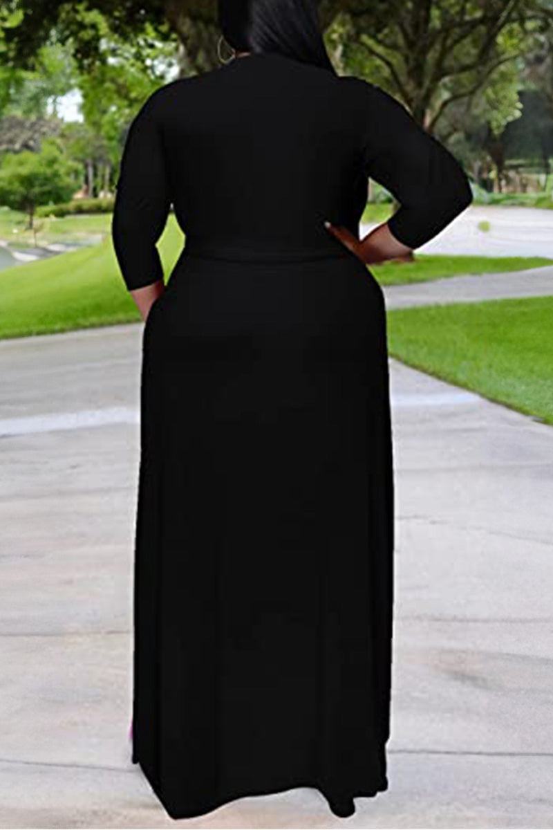 Plus size black belted dress with 3/4 sleeves and swing skirt viewed from back