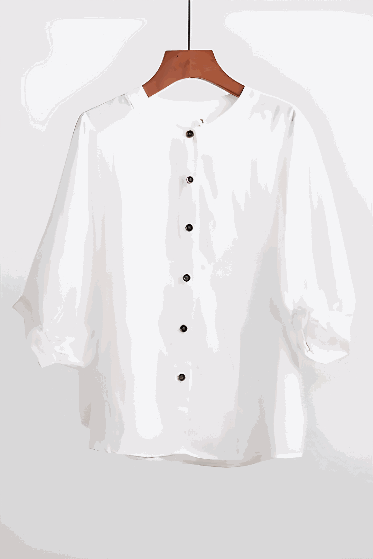 Relaxed loose breathable linen blouse in white with button-down front and long sleeves