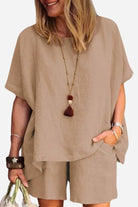 Woman wearing comfy linen-like shirt and shorts two-piece set in beige color