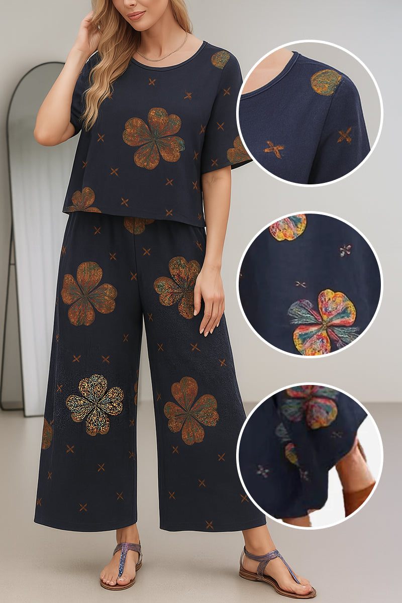 Women's loose fit co-ord set with short sleeves and wide-leg pants in navy blue floral print, relaxed and breathable fabric.