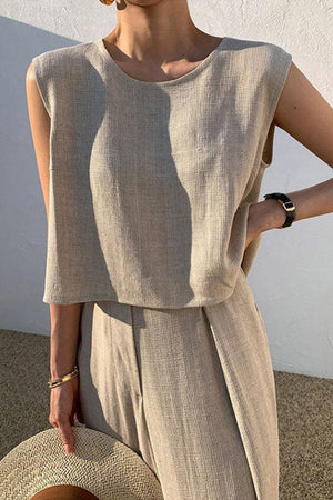 Woman wearing beige Casual Radiance Loose-Fit Combo sleeveless top and loose pants, styled for casual comfort and elegance.