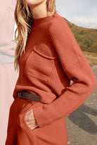 European Minimalism relaxed knit sweater top and trouser set in rust color with pocket detail and belt.