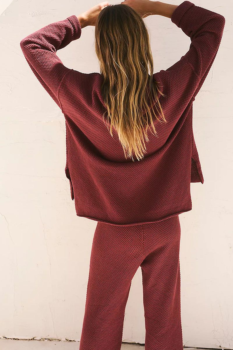 woman wearing multi-weather comfort two-piece oversized set in claret red back view