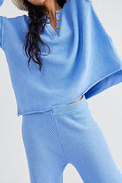 Woman wearing blue two-piece oversized knit set for multi-weather comfort