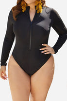 Plus size black zip front long sleeve one-piece swimsuit with high-leg cut and elevated collar