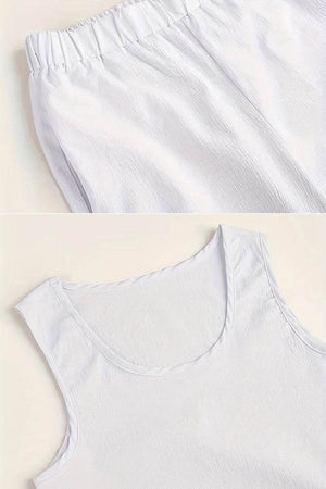 White sleeveless top and elastic waist pants set designed to balance apple-shaped body silhouette