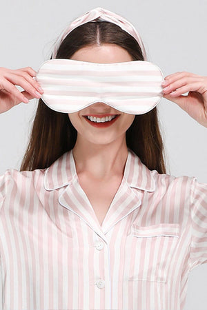 woman wearing 100% mulberry silk striped long sleeve pajama top with matching eye mask and headband