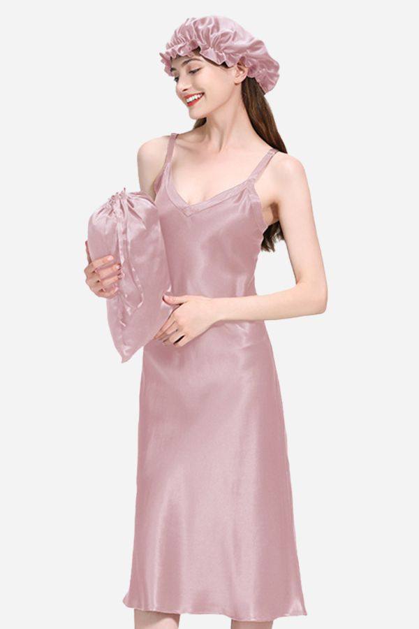 Woman wearing a pink Mulberry Silk Elegant Night Dress with matching cap and pillow cover